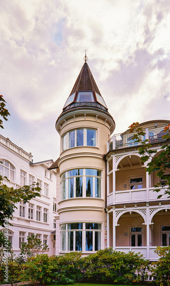 Fototapeta premium Historic house with tower in the old town of Binz. Summer city on the Baltic Sea coast. Rügen is a popular tourist destination. Mecklenburg-Vorpommern