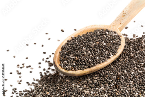 Chia seeds on wooden spoon isolated with open white upper left corner