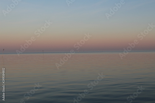 the North Sea  dipped in the evening sun in pastel colors