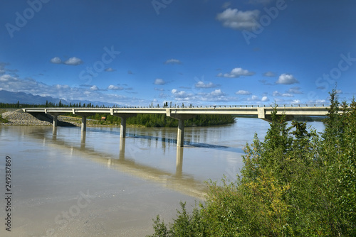The Tanana River and bridge over Tanana river in Alaska Range - The landscape around Alaska Highway, Alaska, USA photo