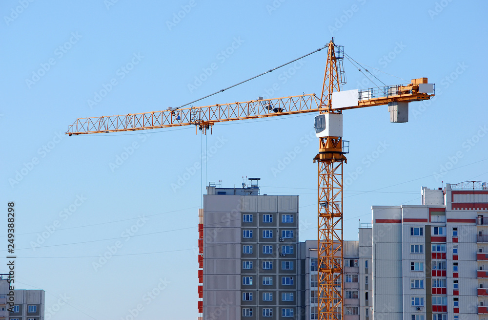 Tower crane on the construction of a new residential building for new buildings