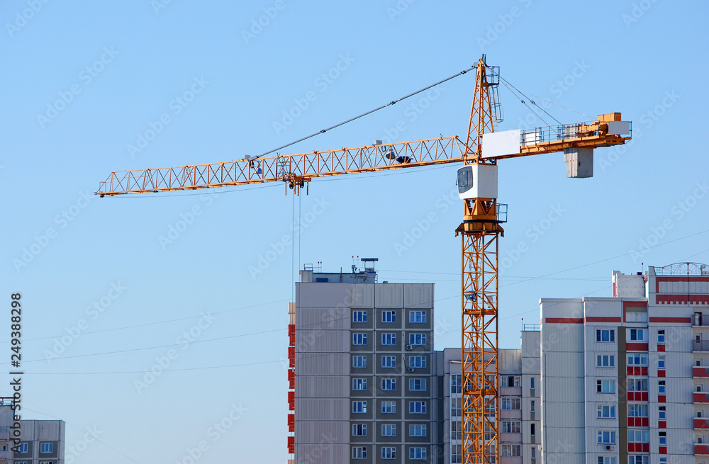 Tower crane on the construction of a new residential building for new buildings Tower crane on the construction of a new residential building for new buildings