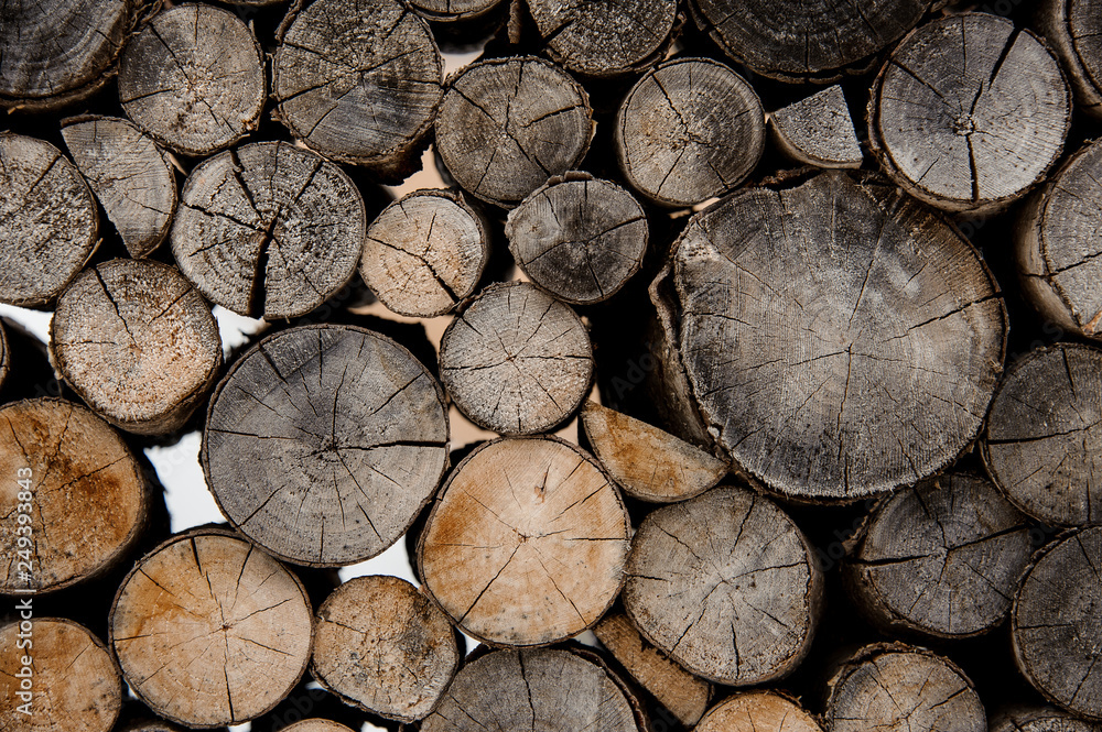 Background of the cracked firewood logs in cut Background of the cracked firewood logs in cut