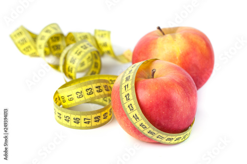 Apples with measure tape on white background, healthy diet