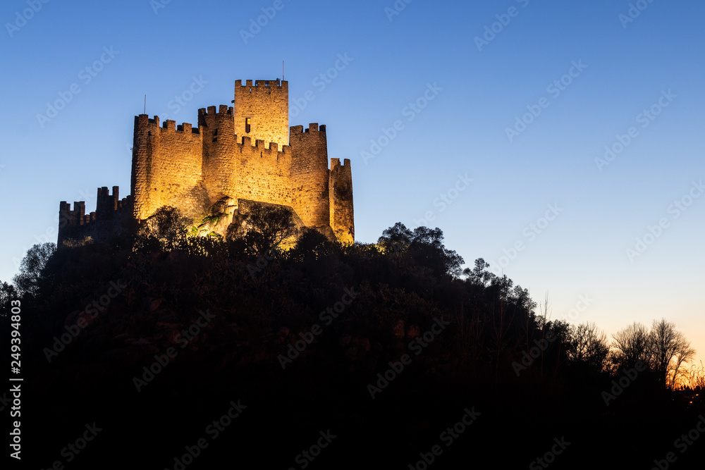 Almourol, Portugal - January 12, 2019: Almourol castle at dusk and illuminated by artificial light. Almourol, Portugal - January 12, 2019: Almourol castle at dusk and illuminated by artificial light.