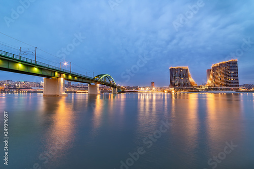 Belgrade, Serbia - February 10, 2019: A panorama of Belgrade seen from the banks of the Sava River. Old bridge and waterfront of Belgrade. © nedomacki