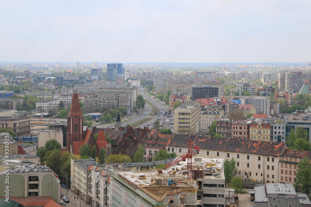 Spring day in Wroclaw. View from the tower of the church of Saint Elizabeth to the west of the city. Visible buildings, blocks of flats, tenements, office buildings, Legnicka street. Wrocław, Breslau
