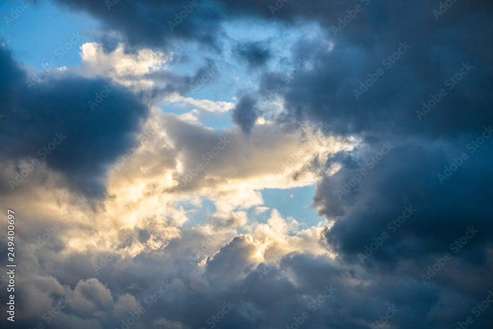 blue heavenly sky with clouds and sun