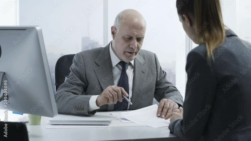 Financial advisor meeting a customer in the office Financial advisor meeting a customer in the office