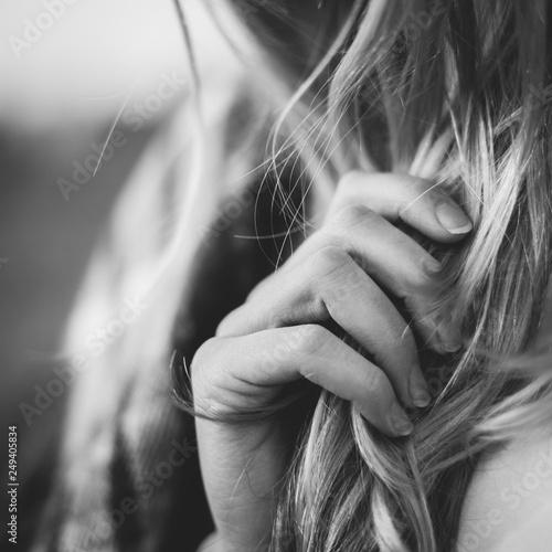 Young woman holding hair