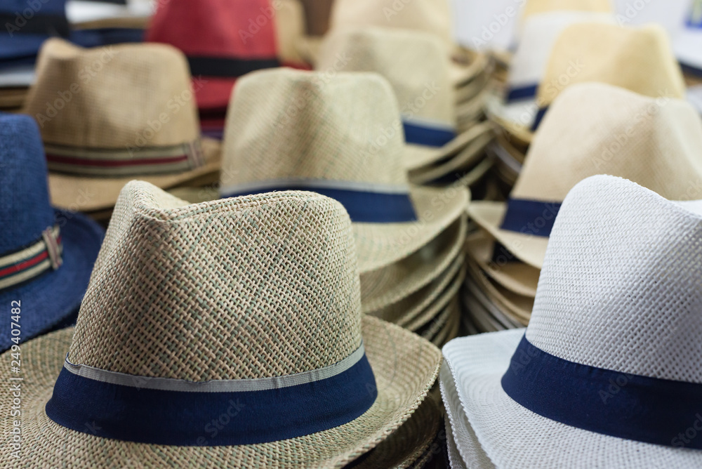 Close-up of different hats for sale for men and women