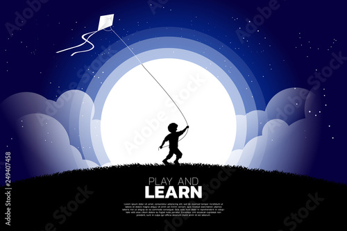 silhouette of boy running with flying kite in the sky at night. Concept of children play and learn.