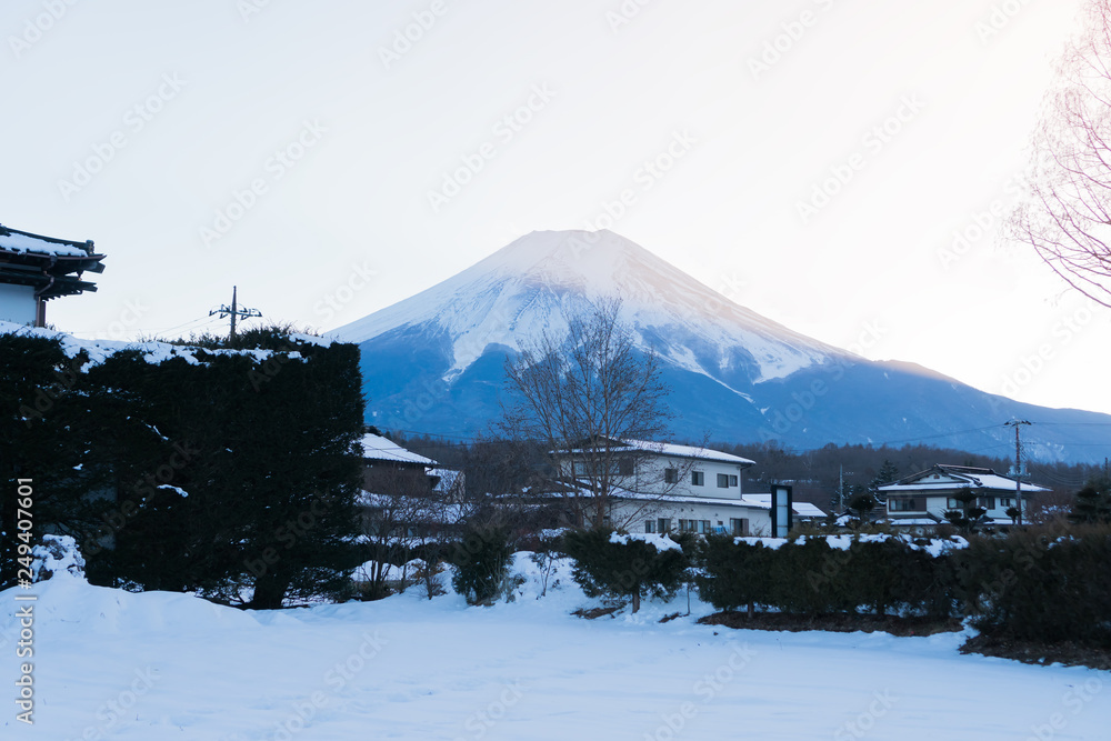 Mount Fuji at Oshino Hakkai in snow fall. Traditional Japanese style house with mt.fuji, Landmark of life Japan's strong community famous tourist destination village in Japan