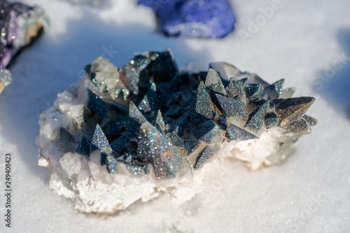 Calcite Cluster Points covered with Pyrite on white snow at a sunny winter day. © bjphotographs