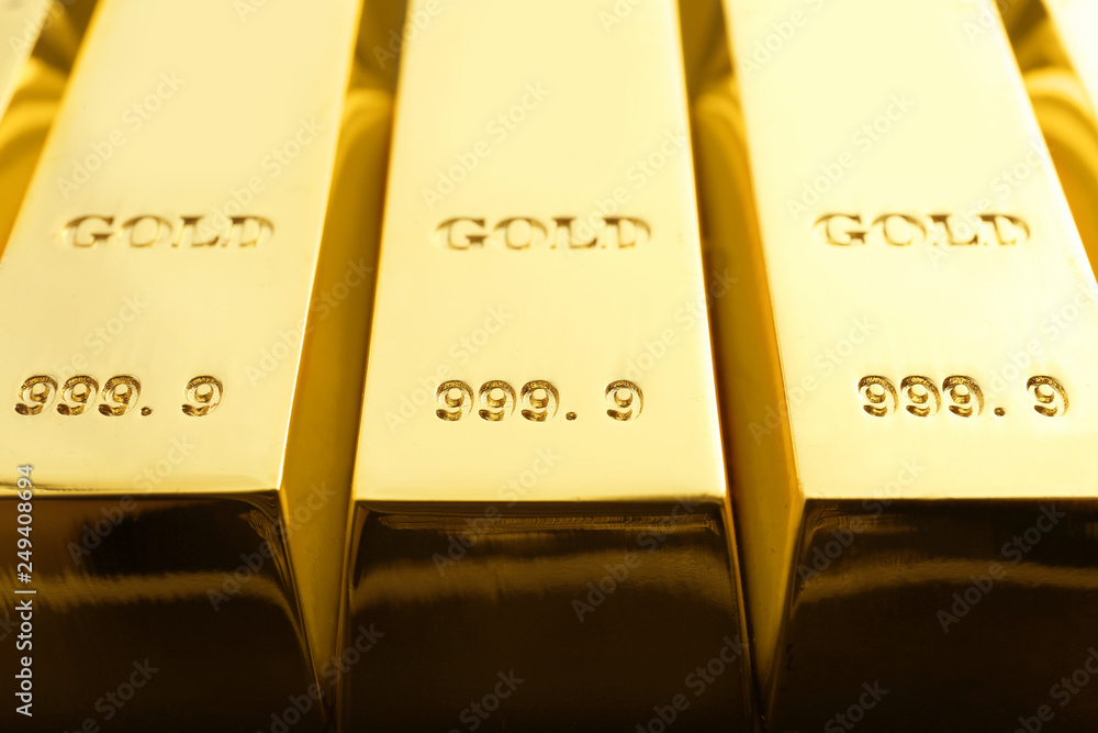 Shiny sleek gold bars as background, closeup Shiny sleek gold bars as background, closeup