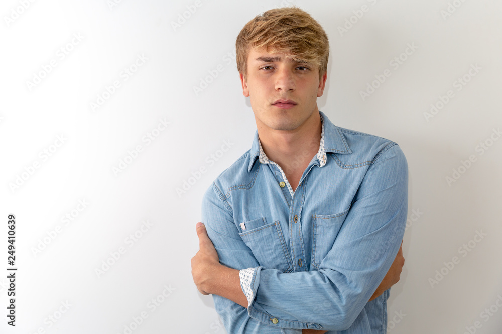 Pensive young man portrait in white background Pensive young man portrait in white background