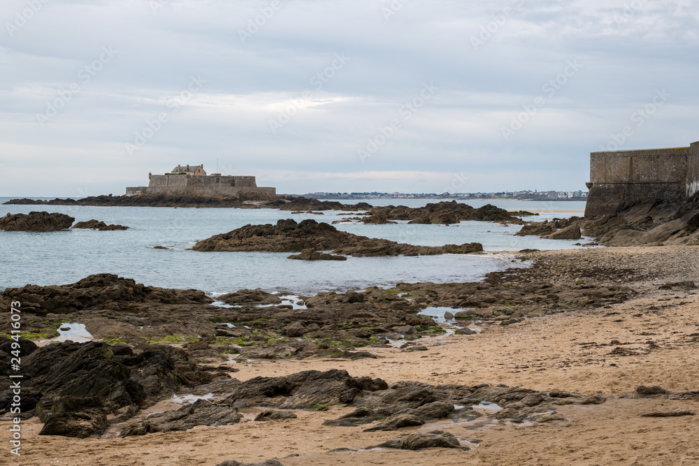 The beach, rocks and Fort National during low tide in Saint Malo