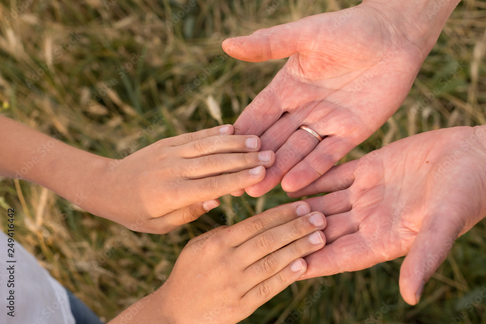 hands of the child in the hands of fathers. father and son. the hands of an adult and a child. adult and child trust hands of the child in the hands of fathers. father and son. the hands of an adult and a child. adult and child trust