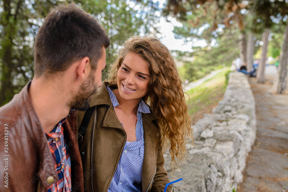 Happy young couple in the public park