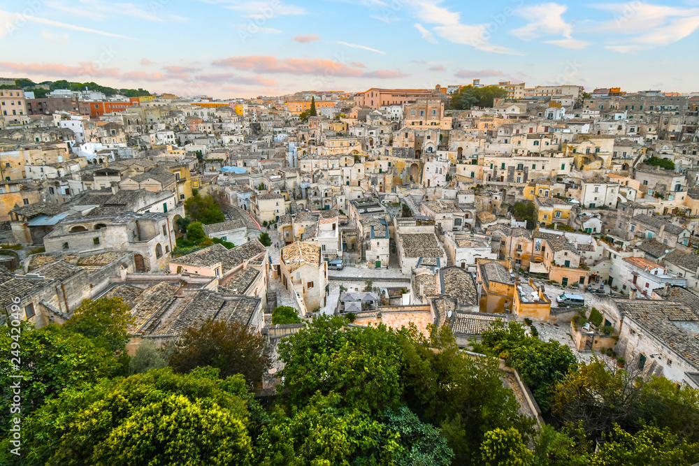 Late afternoon view of the ancient, medieval city of Matera, Italy, an Unesco World Heritage site, from a hill overlooking the homes and shops in the Southern Basilicata region.