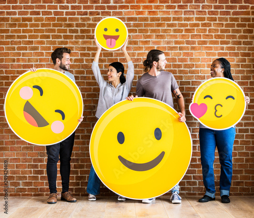 Obraz na plátně Diverse people holding positive emoticons