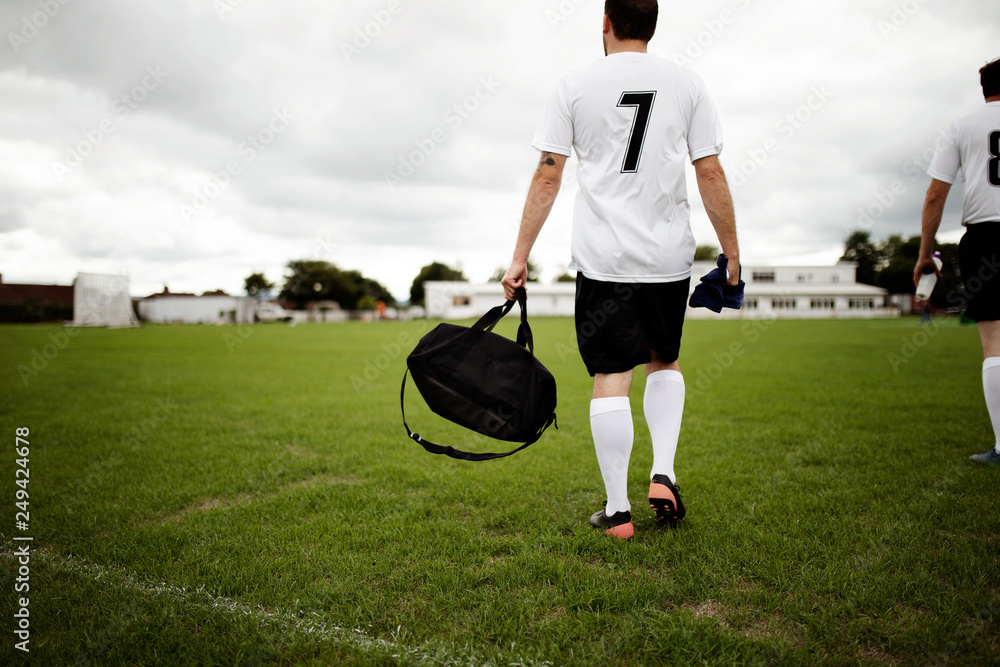 Football player ready for practice - obrazy, fototapety, plakaty 