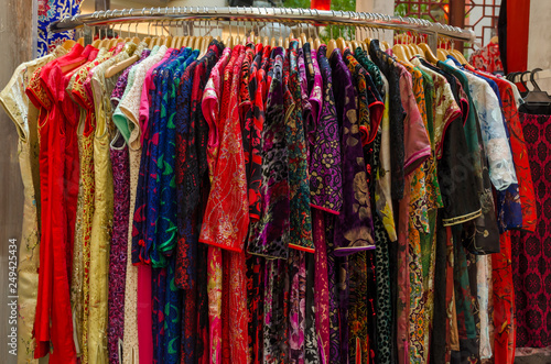 Wallpaper Mural Colorful chinese cheongsam hanging for sale during Chinese New Year. Torontodigital.ca
