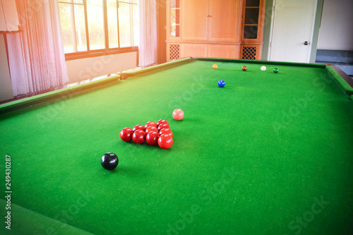 Snooker balls set on green snooker table indoor sports club / billiards game