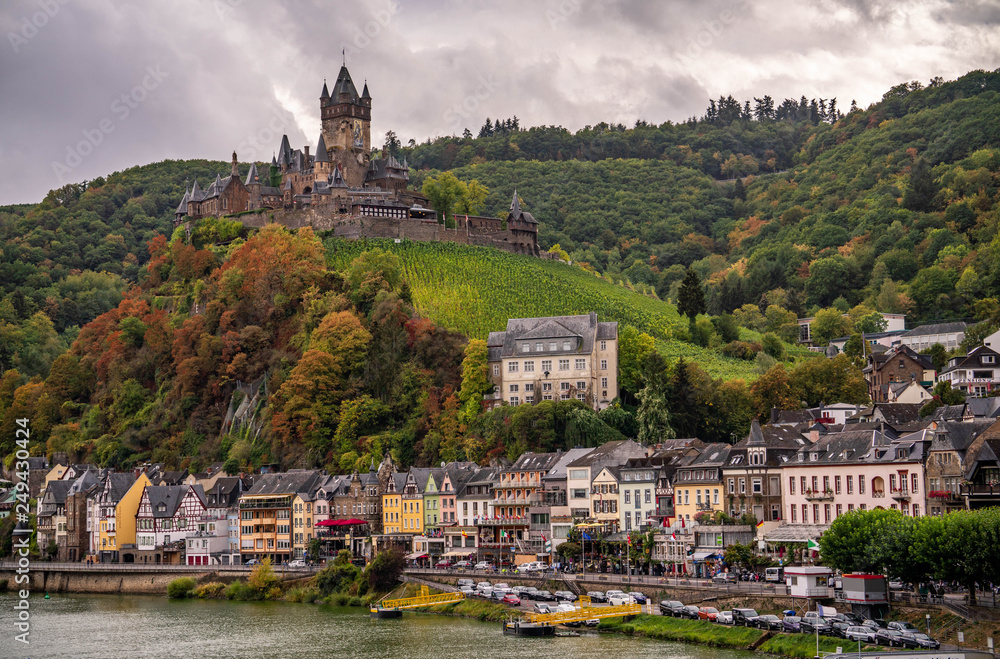 Fairytale village of Cochem with hilltop castle in autumn.