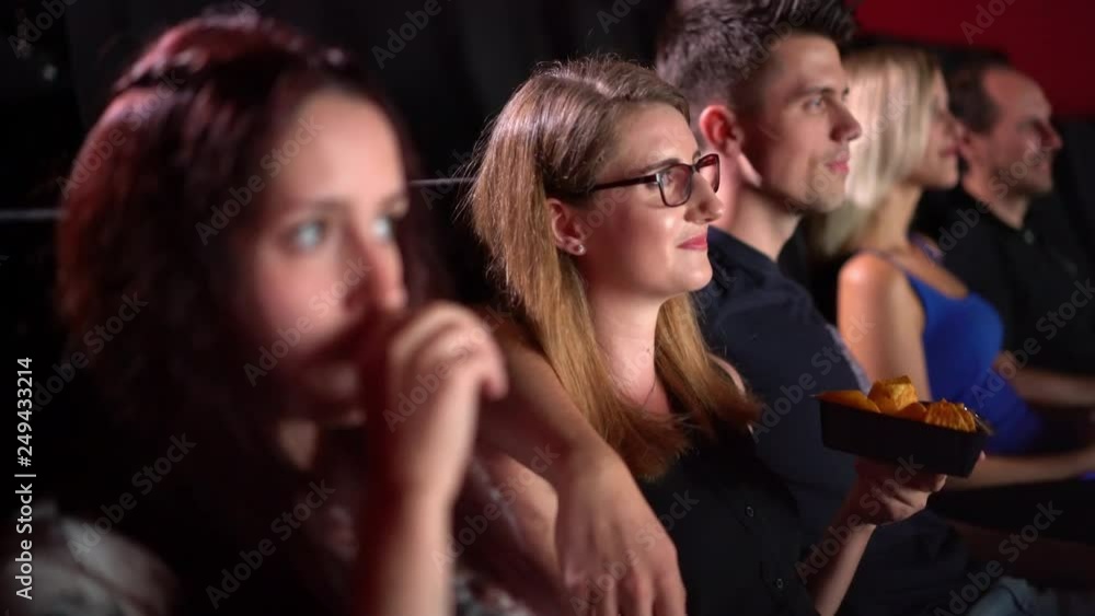 Watching a movie in a cinema - movie theater Watching a movie in a cinema - movie theater