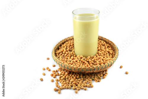 Soy milk in the glass and soybean seeds on threshing basket isolated on white background - soya beans © Bigc Studio