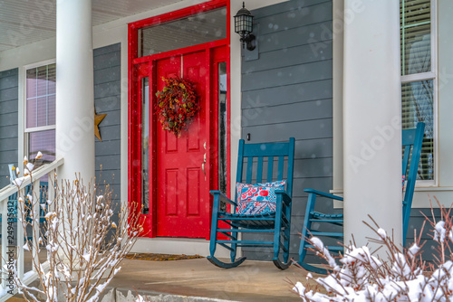 Fotótapéta Winter view of home with red door and front porch