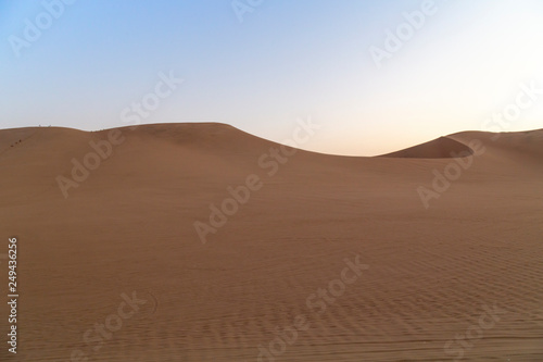 Desert during sunset at Huacachina Oasis in Ica, Peru.