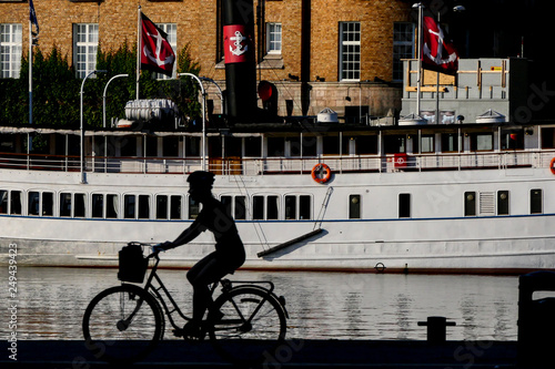 Photography Stockholm, Sweden A lone bicycist on Strandvägen in the early morning
