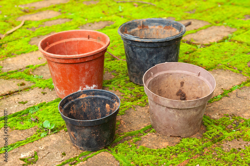 Colored empty flowers pot for gardening - mud dirt used © tacio philip