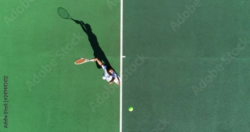 A Tennis player serves an ace and celebrates the shot.