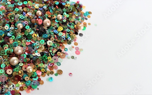Photos Colorful sequins for embroidery on white background