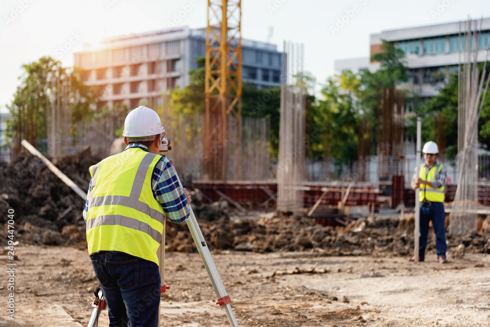 Surveyor equipment. Surveyor’s telescope at construction site or Surveying for making contour plans is a graphical representation of the lay of the land startup construction work. Surveyor equipment. Surveyor’s telescope at construction site or Surveying for making contour plans is a graphical representation of the lay of the land startup construction work.