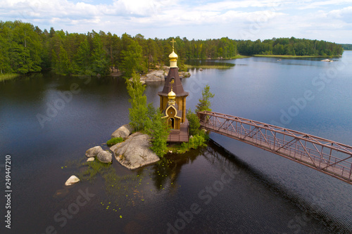 Church of Apostle Andrew the First-Called on the Vuoksa River on a June morning (aerial photography). Leningrad region, Russia photo