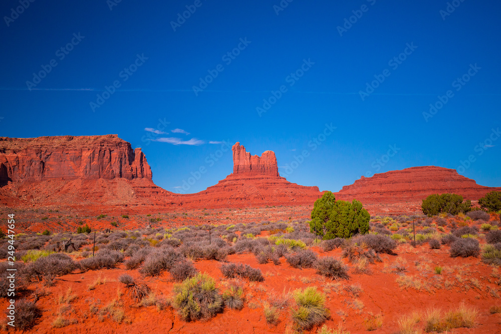 Fototapeta premium Monument Valley. Navajo Tribal Park. Red rocks and mountains. Located on the Arizona–Utah border. USA