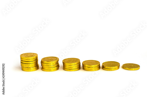 Bunch of chocolate gold coins on white background