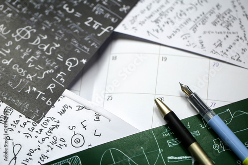 Math problems on graph paper with pencil ,formula arithmetic using for concept of World Maths Day.