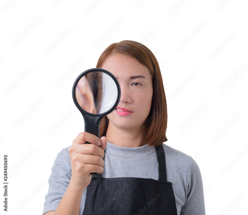 worker woman or Servicewoman, investigator in Gray shirt and apron is holding or looking with magnifying glass isolated worker woman or Servicewoman, investigator in Gray shirt and apron is holding or looking with magnifying glass isolated