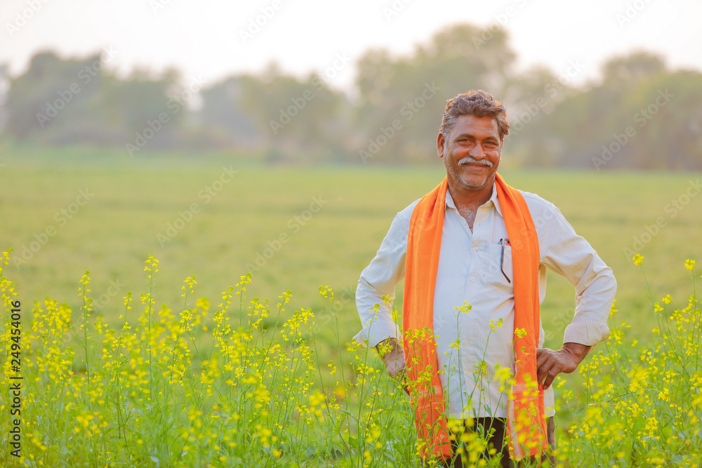 Indian farmer at black musterd field