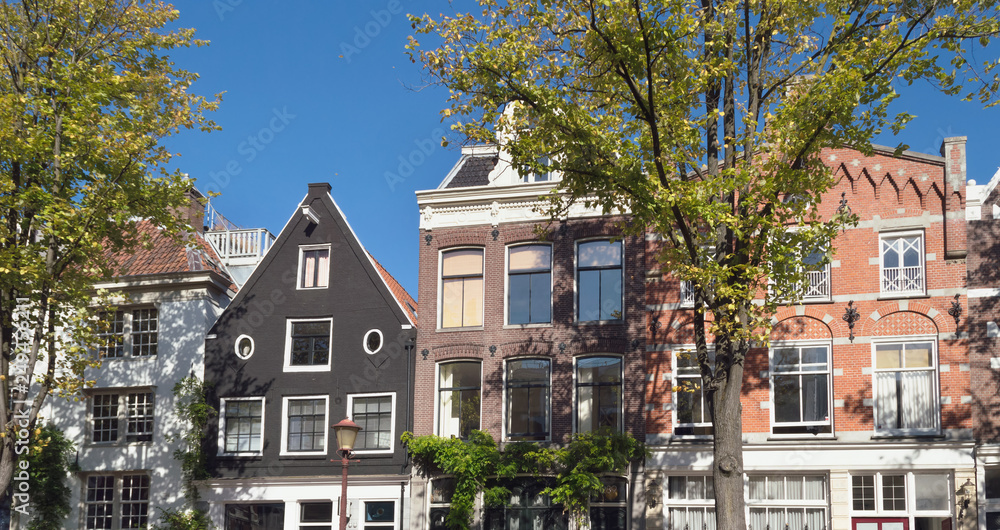 exterior of Amsterdam houses on sunny day