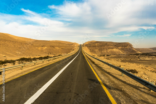 car road on a desert landscape photo