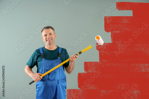 Male painter in uniform wit...
