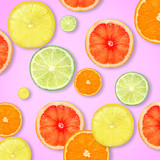 Slices of fresh citrus fruits on color background