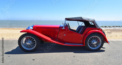 Classic Red Sports Car parked on Seafront  Promenade.