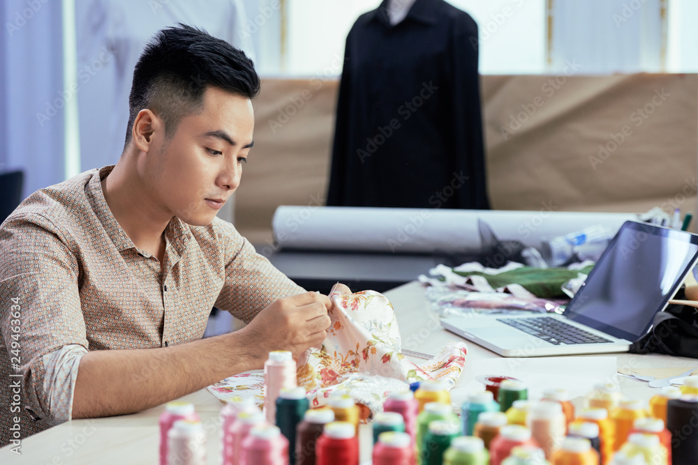 Young tailor at work